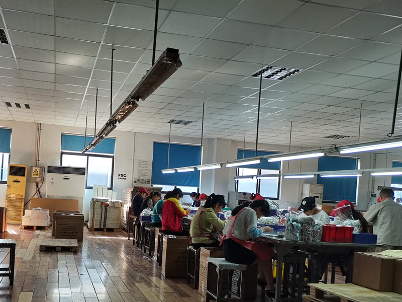 In manual work area of our factory, we do hand assembly work, like put strings on paper bags, paste ribbon or acessories on gift boxes, inspection and other types of hand finishing work
